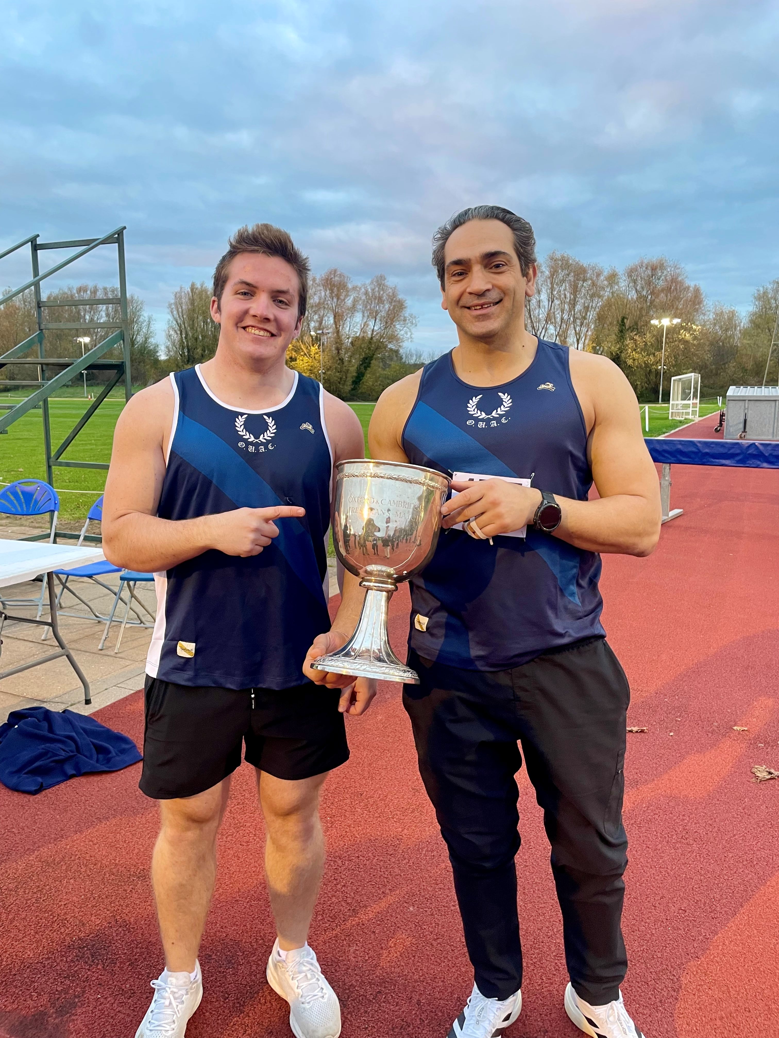Jack Hansen and Ali Safa holding a trophy at the annual Athletic Freshers' Varsity match.