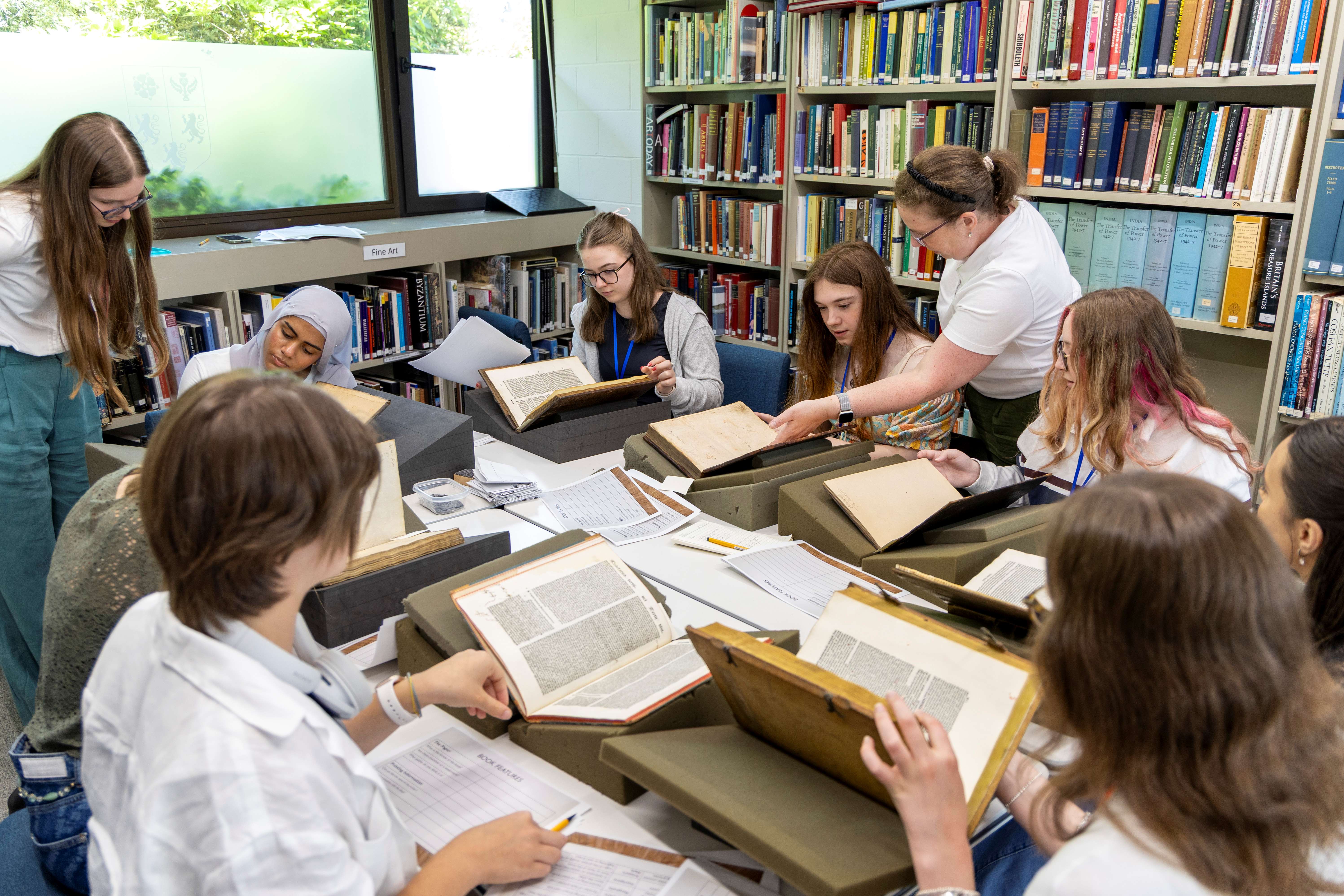 Pembroke Librarian Laura Cracknell delivering an Old Books workshop to OxNet students.