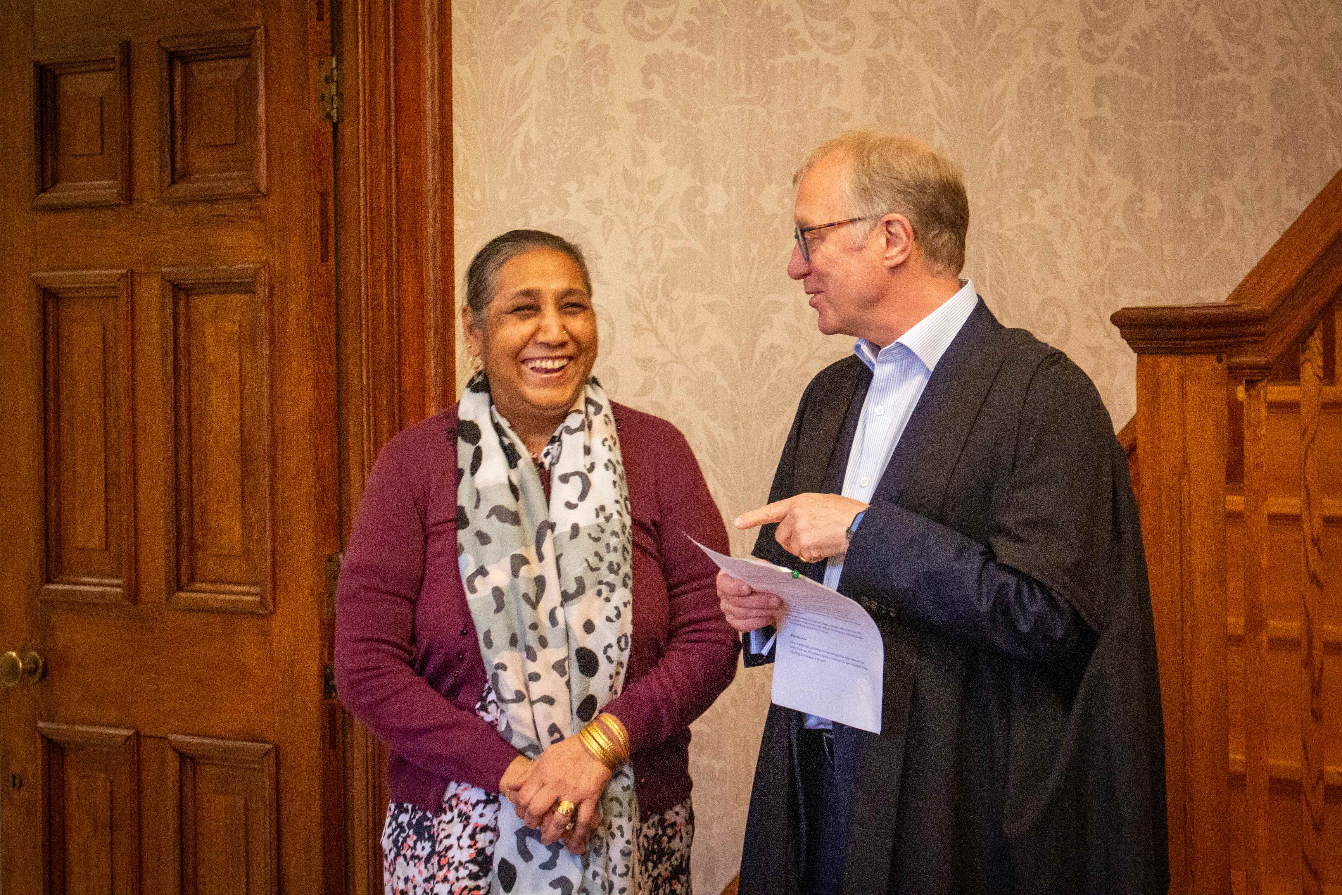 Scout Asha Lal smiling next to Sir Ernest Ryder.