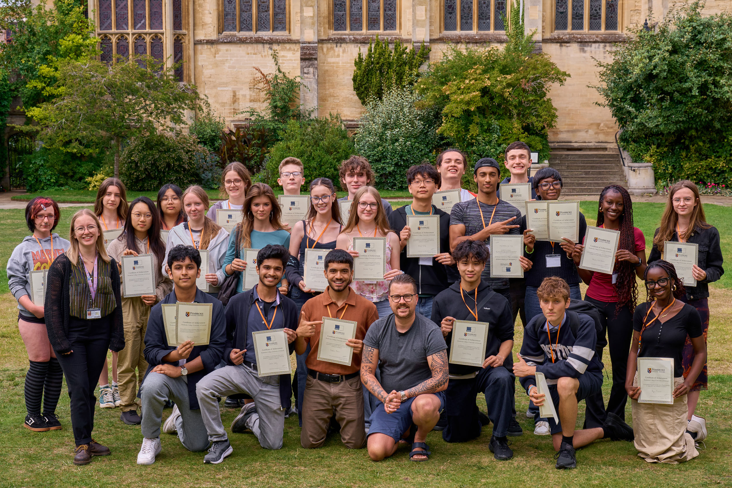 OxNet pupils holding up their certificates.