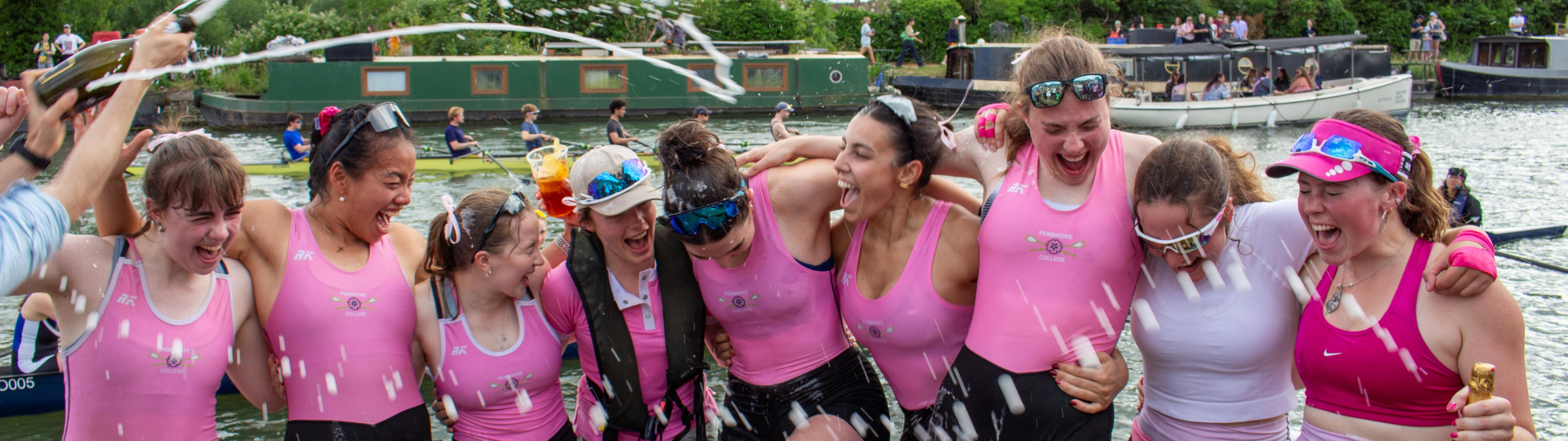 Pembroke College's First Women's Eight celebrating their Headship win at Summer VIII's by being sprayed with Prosecco.