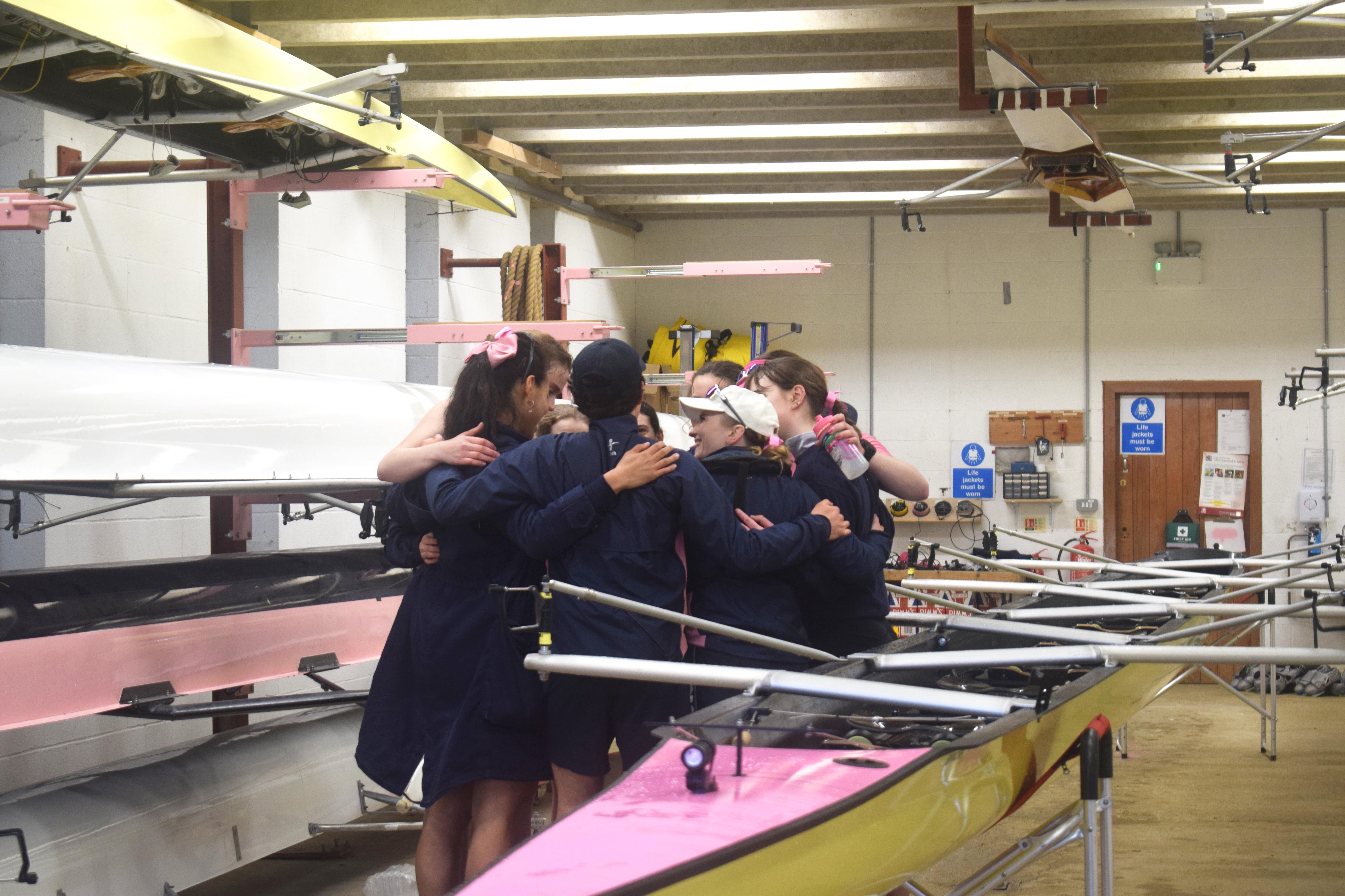 A W1 huddle in the Boathouse.