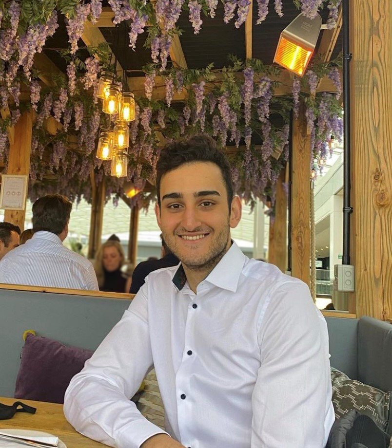 Hakan in restaurant smiling