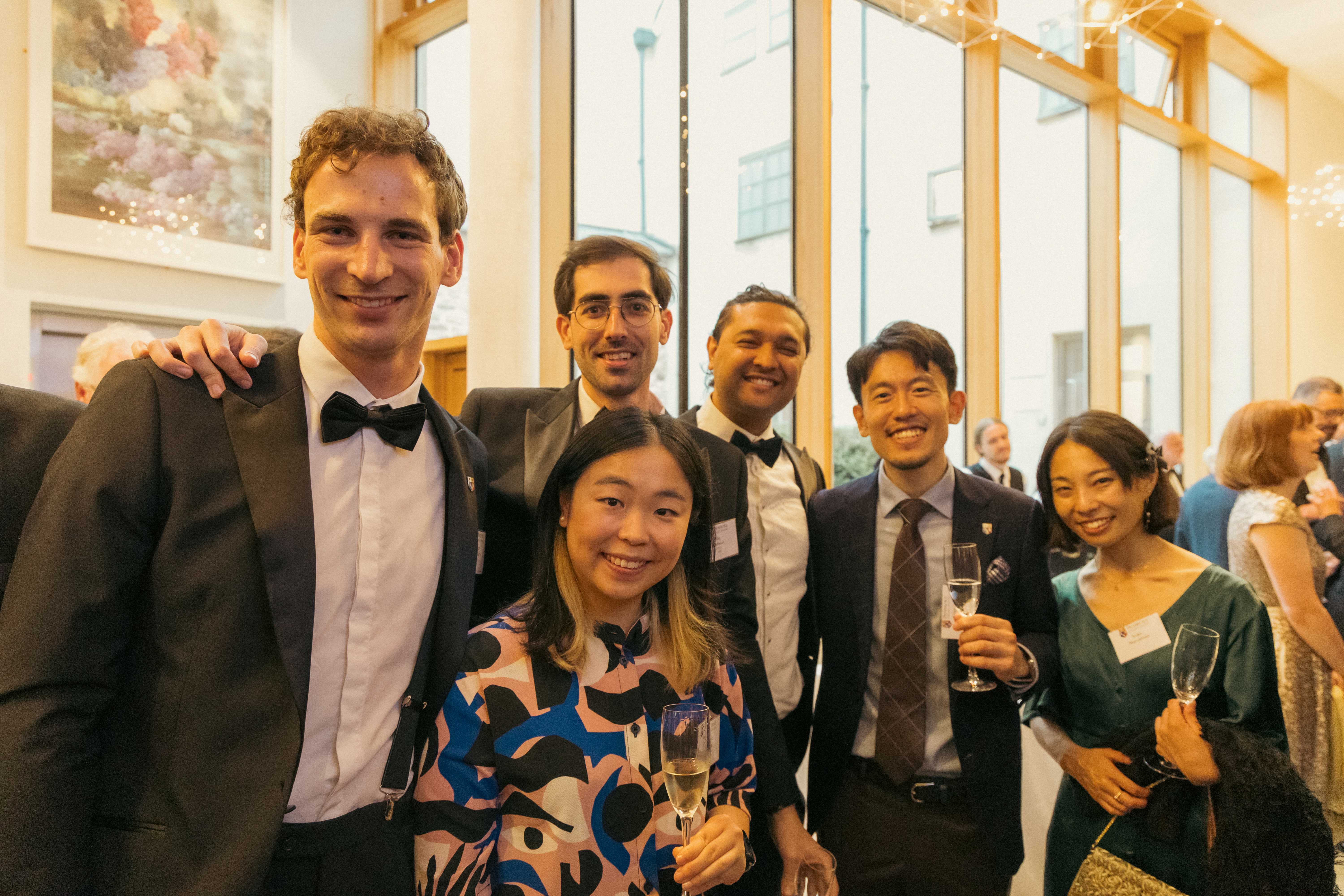 Pembroke alumni at a drinks reception in the Pichette Foyer.