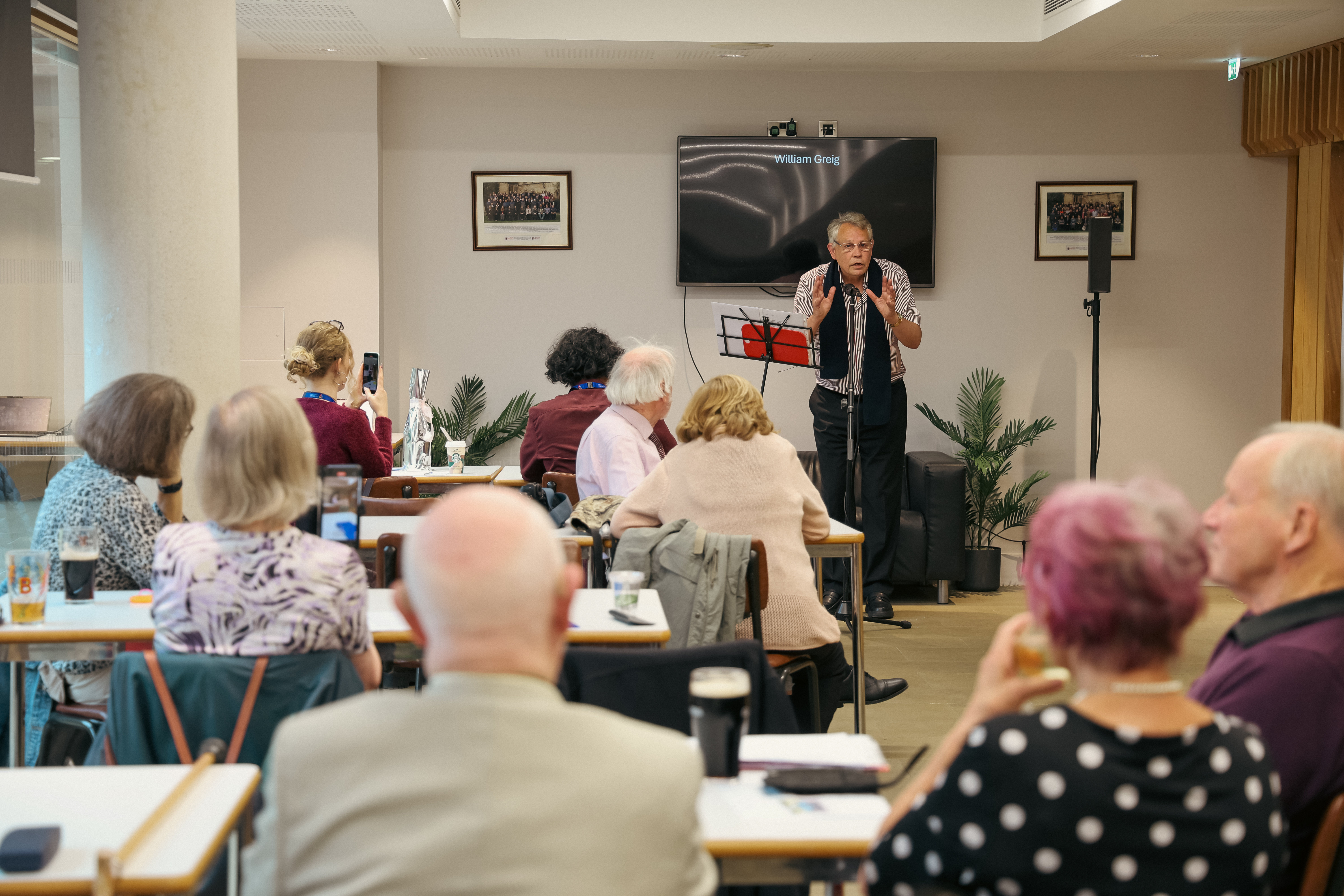 William Grieg performing his poem at the poetry slam in Farthings.