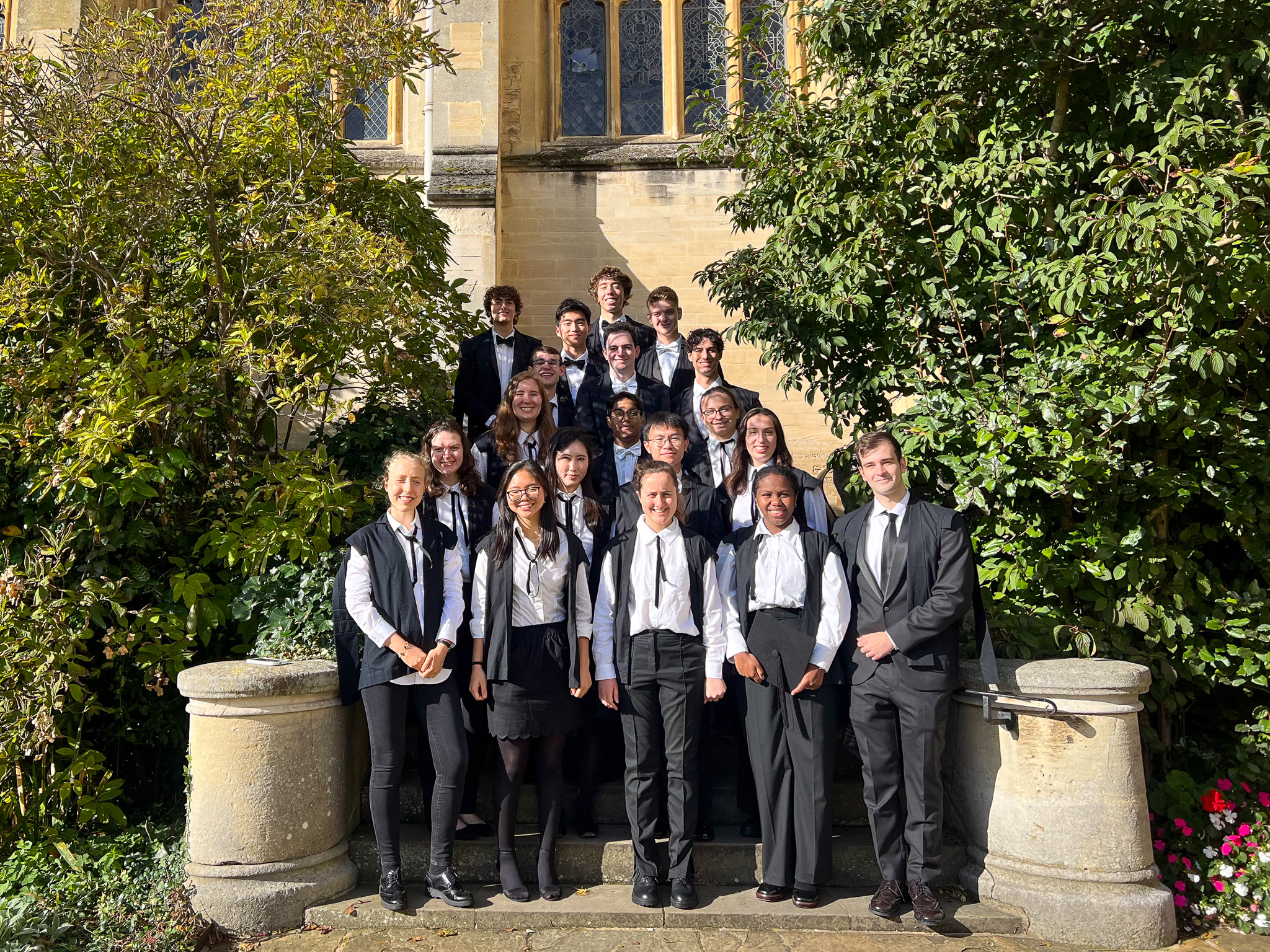 Pembroke Visiting Students in their sub fusc on the steps of the Dining Hall.