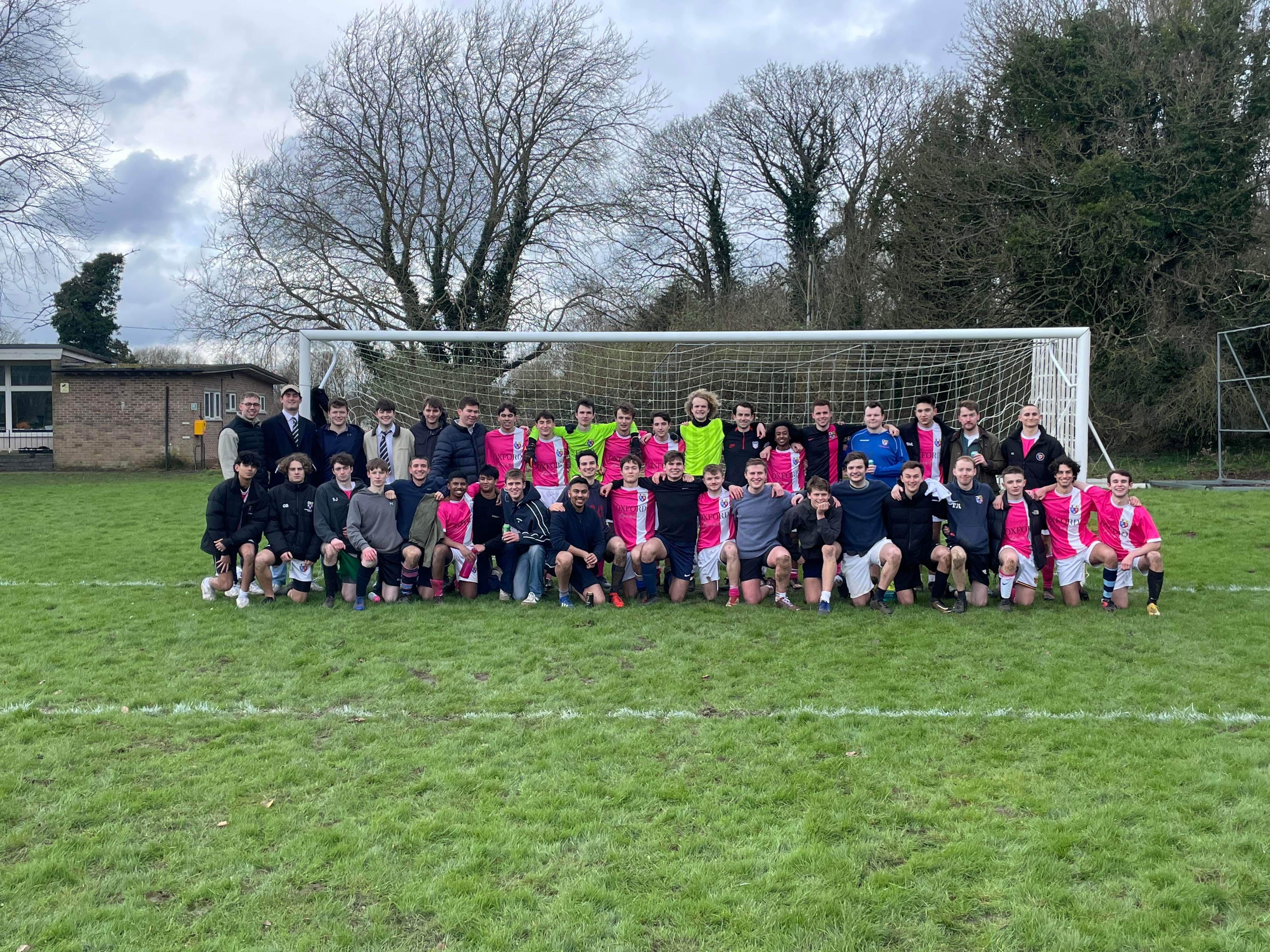 A photo of the Pembroke football team and alumni at their match on Saturday.