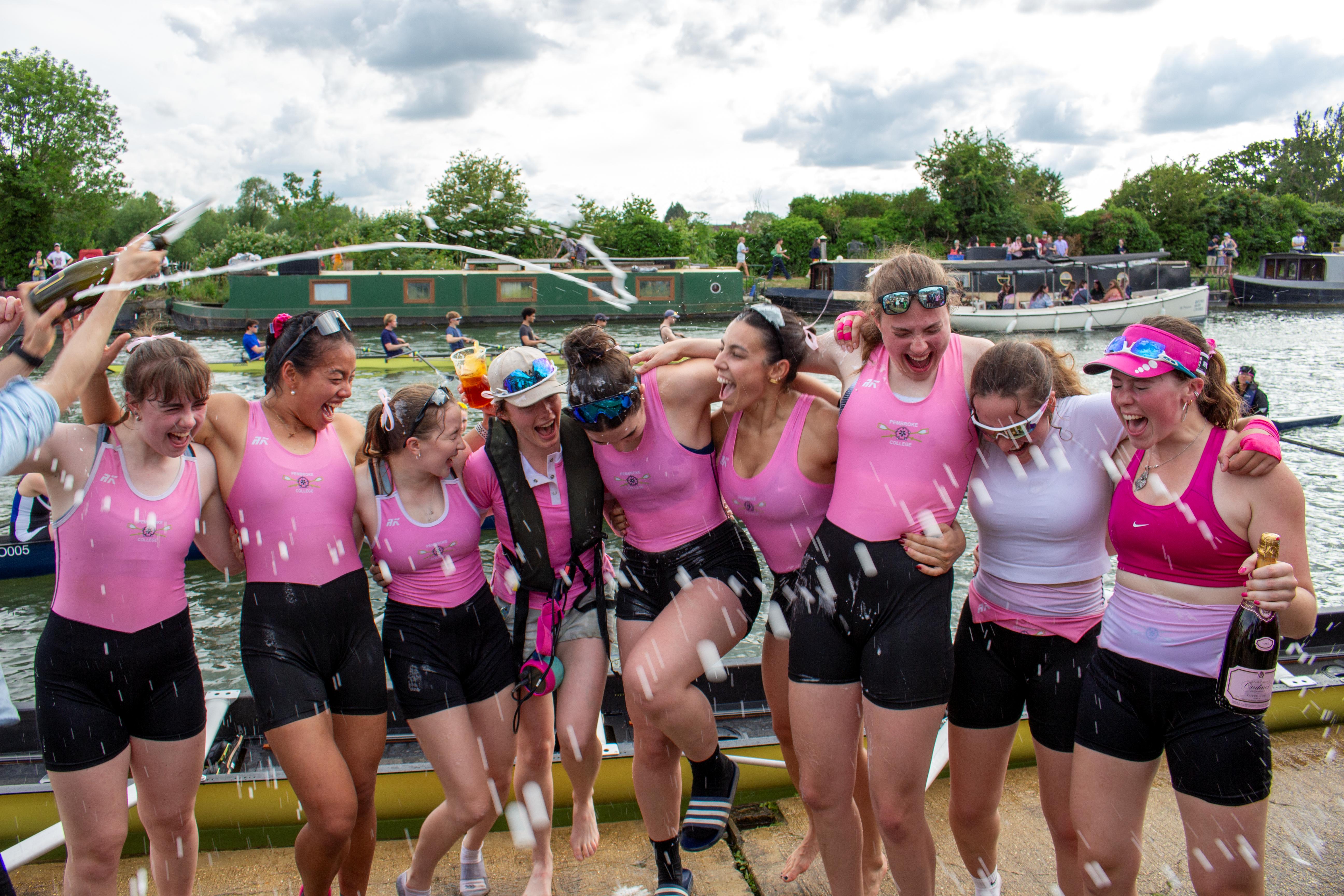 Our W1 Headship crew being sprayed with Prosecco outside the Pembroke Boat House.