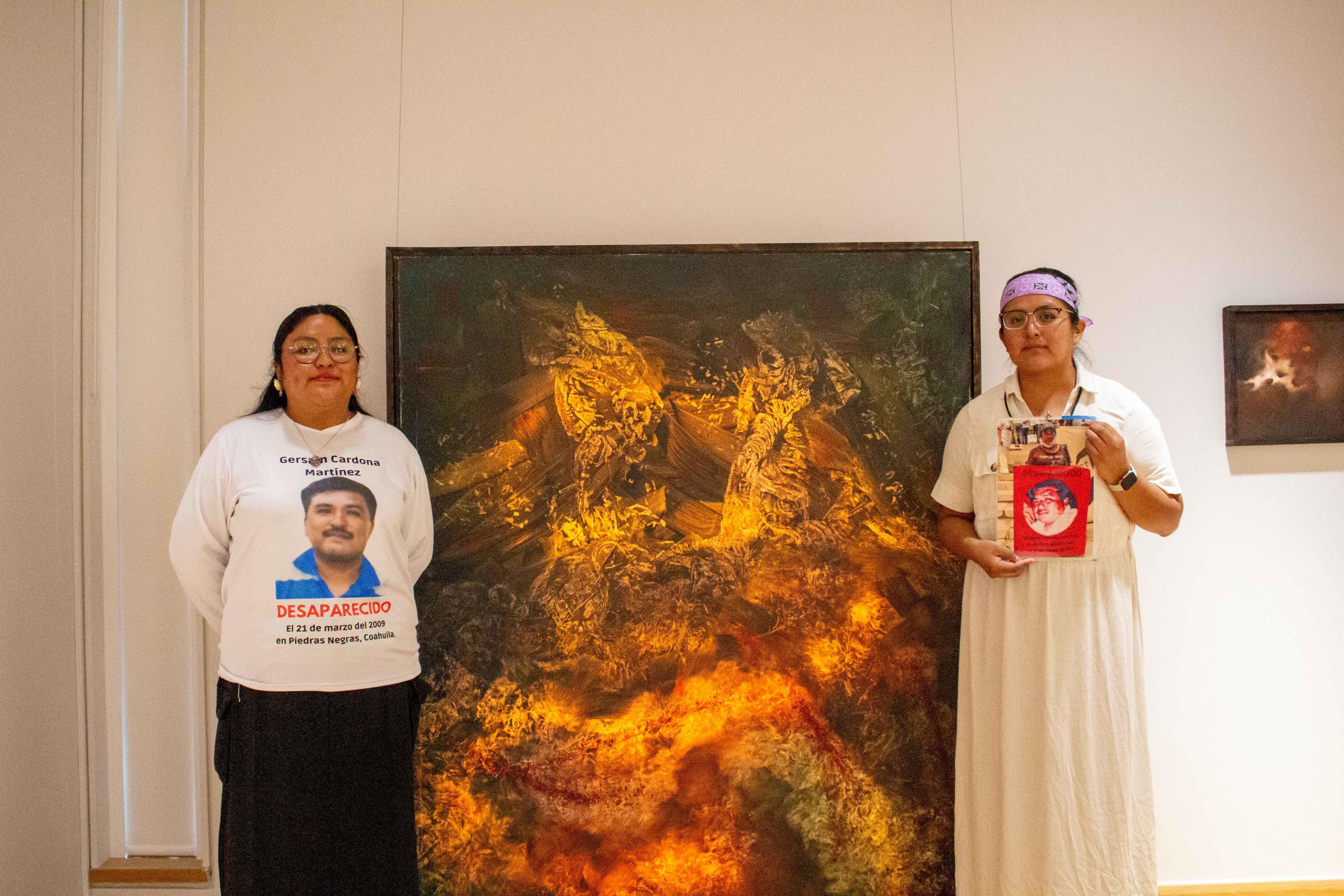 Lizet and Carmen Corazones in front of one of Chantal Meza's paintings.