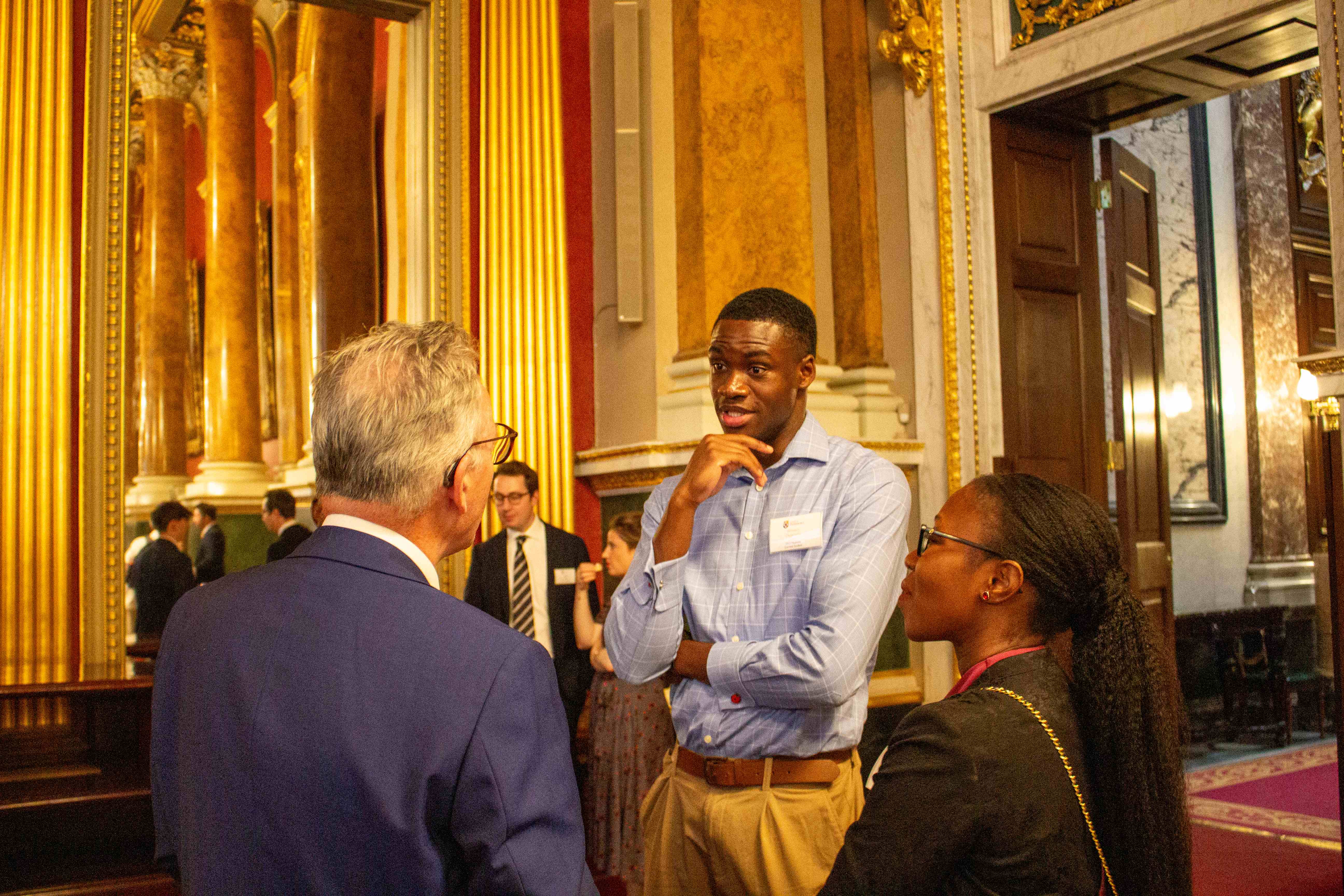 A Pembroke student and Professor Ana Namburete speaking to an alumnus at the Imagine Pembroke launch.