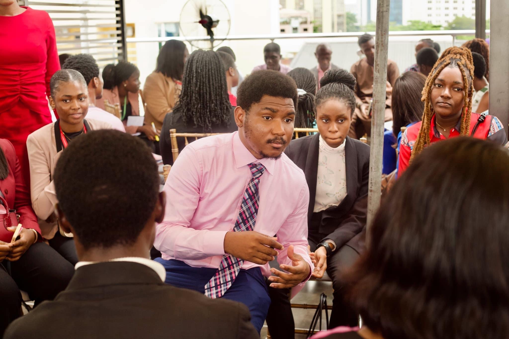 Wantoe Wantoe taking part in small group discussion during conference