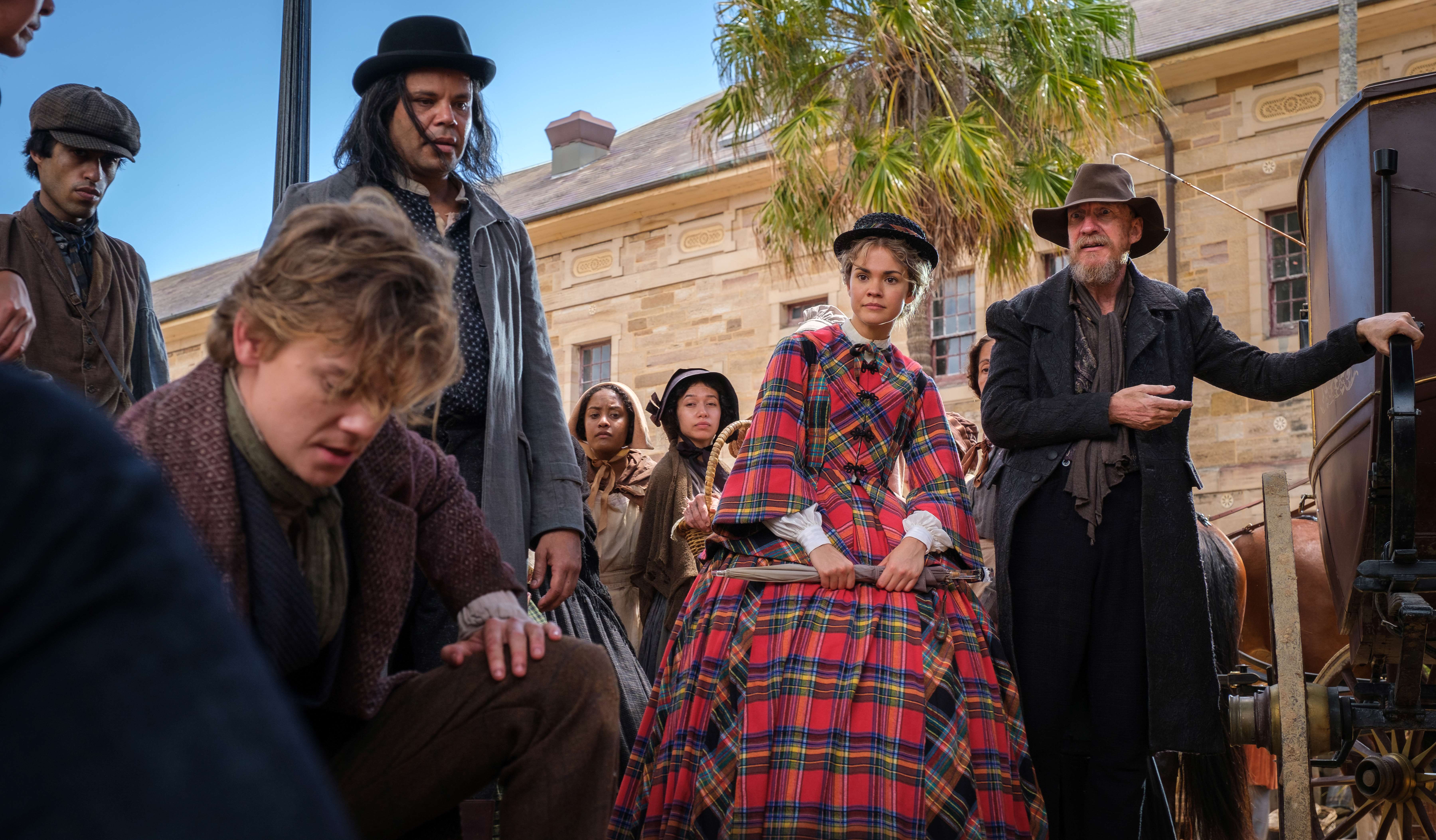 A still from The Artful Dodger, featuring Thomas Brodie-Sangster (left), Maia Mitchell (centre) and David Thewlis (right).