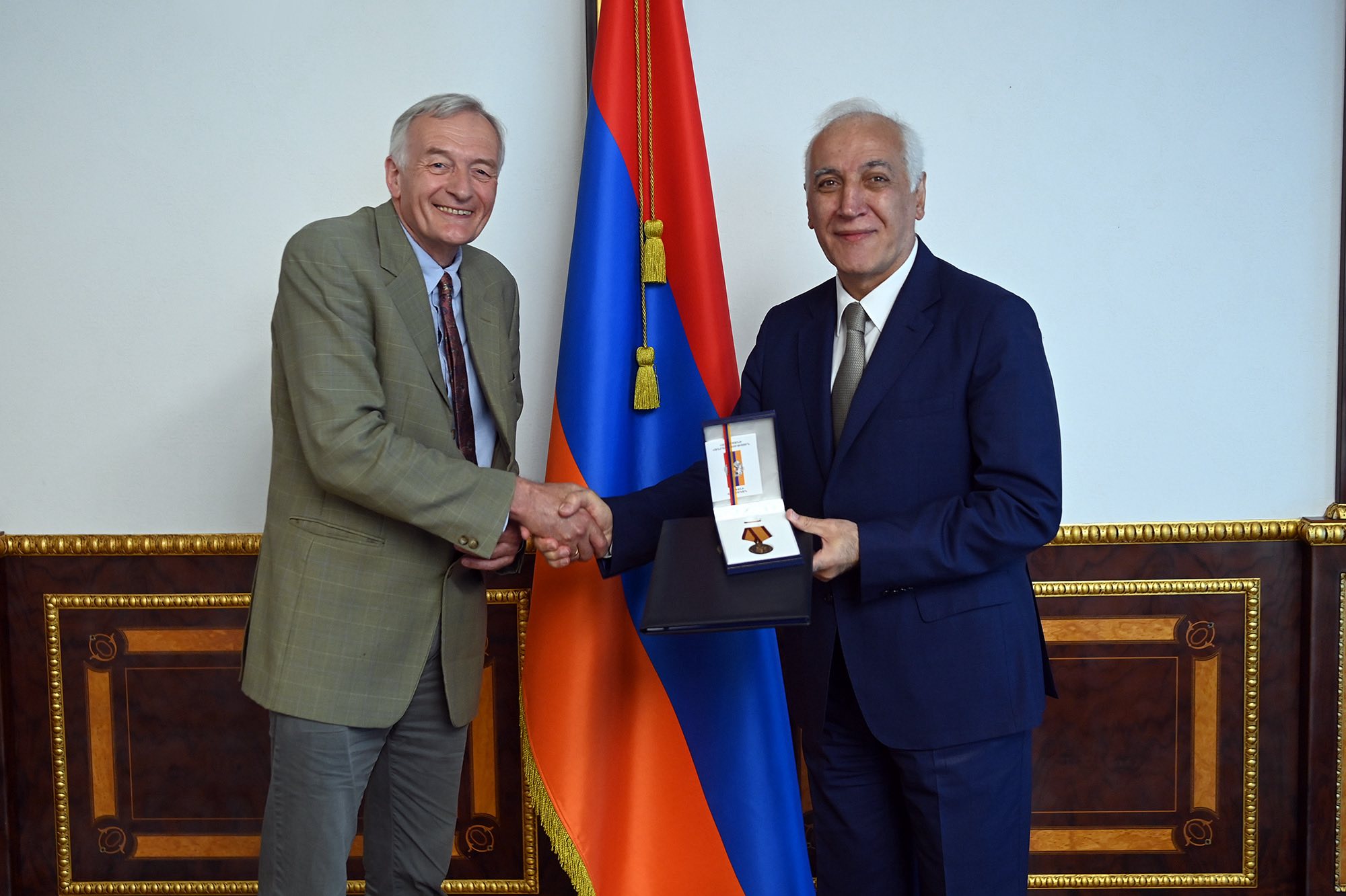 Professor Theo van Lint receiving a medal from the President of Armenia.