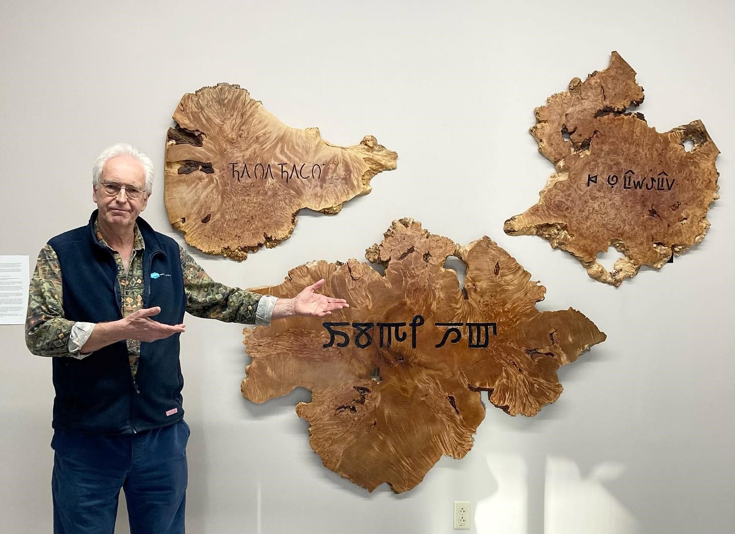 Tim Brookes with alphabet carvings