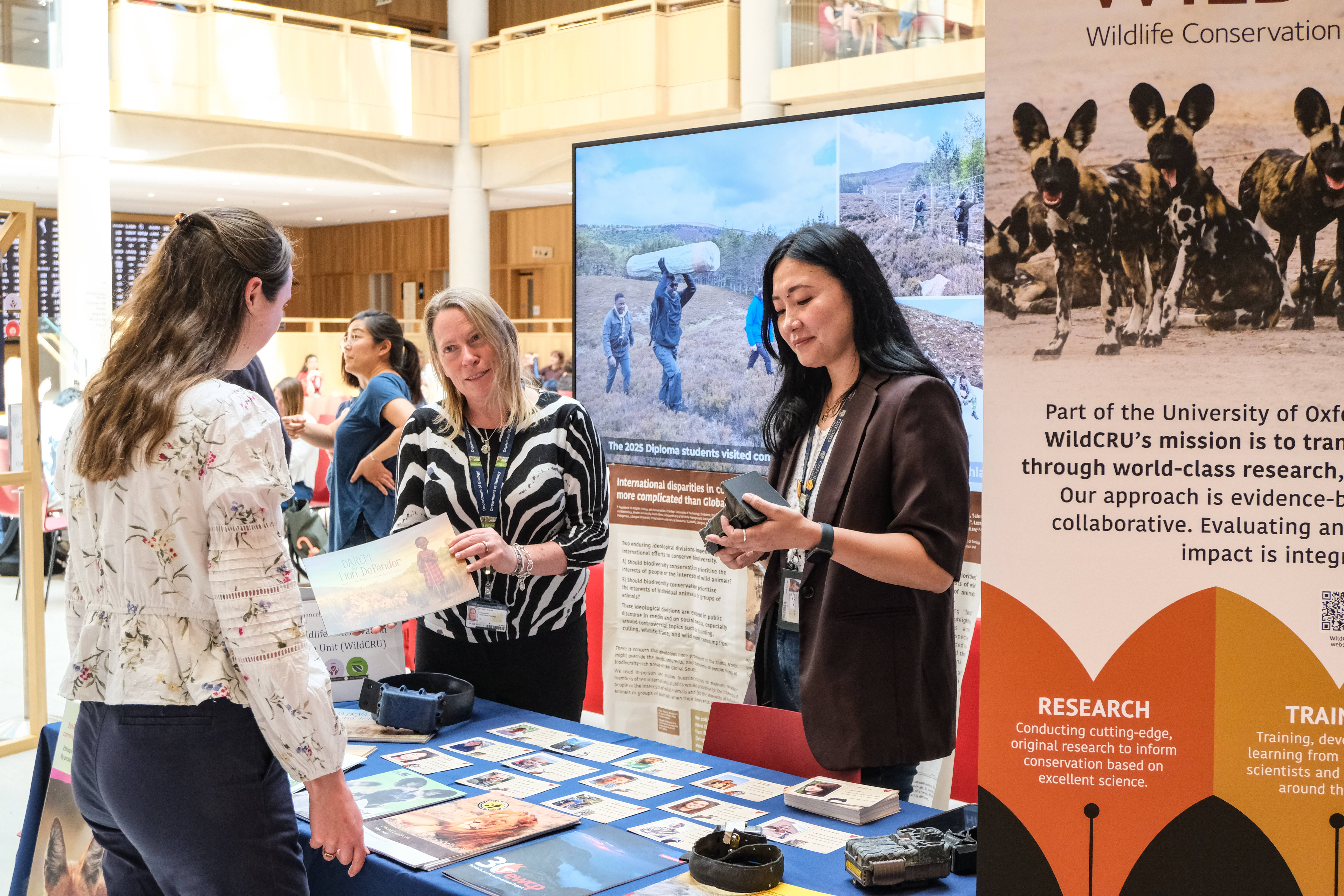 Professor Amy Dickman sharing WildCRU's research at a poster show at the Schwwarzmann Centre