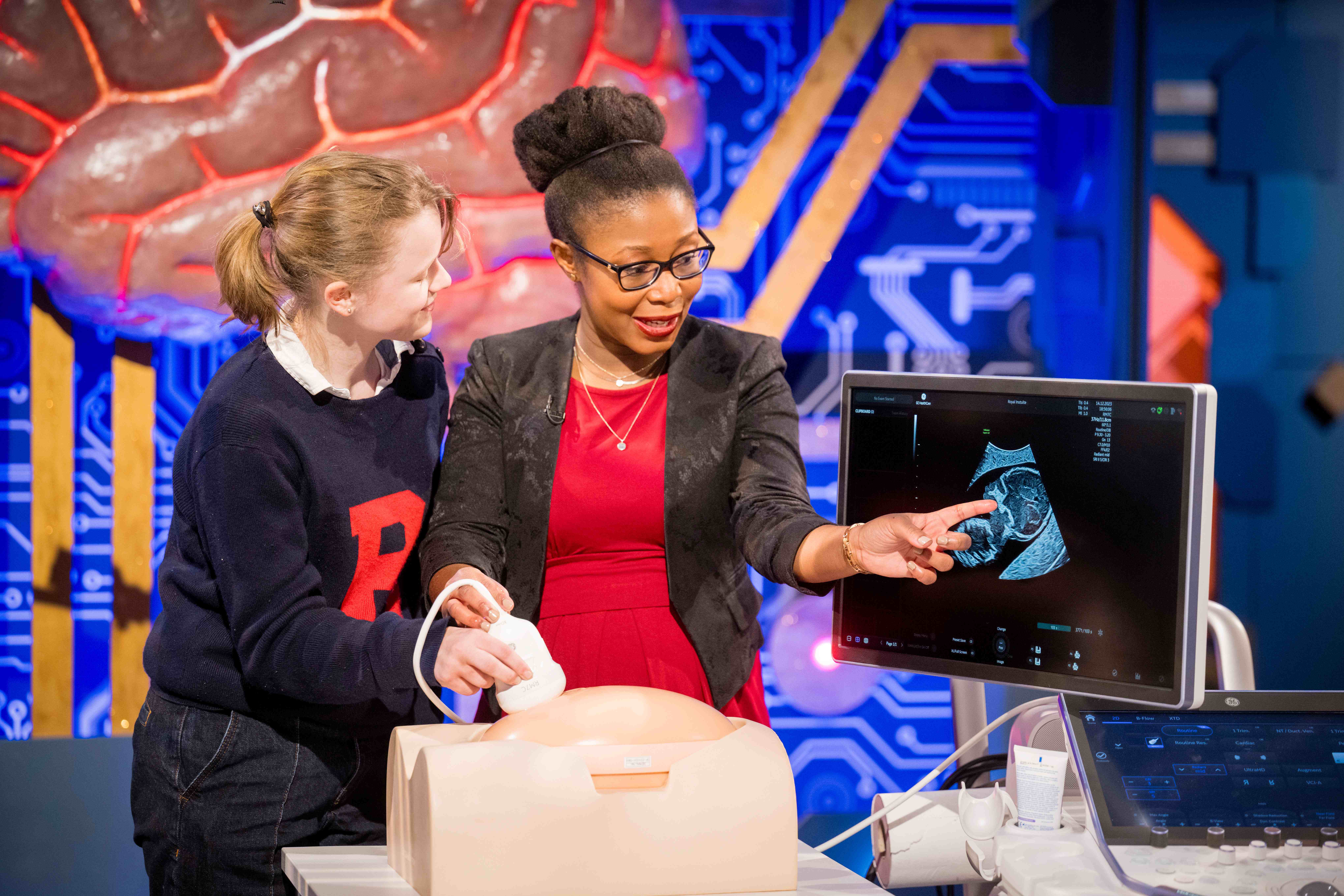 Professor Ana Namburete points to an ultrasound image produced by an artificial model of a mother's abdomen.