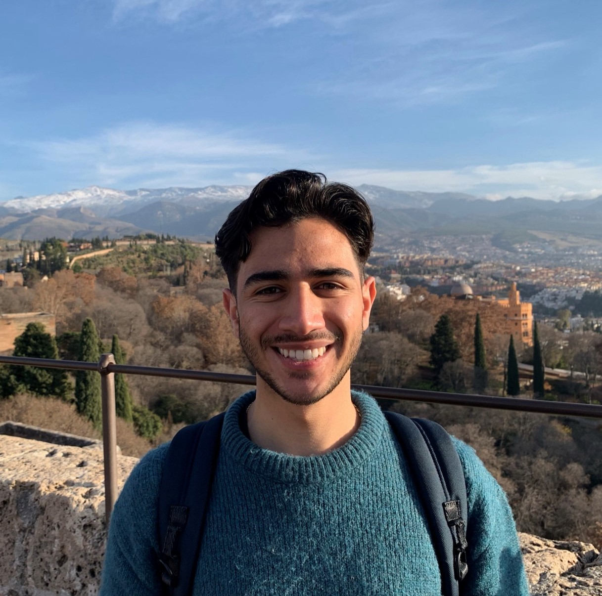 Ariff Smiling with a landscape view behind him