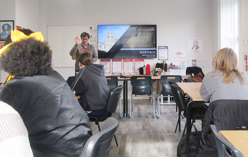 Prof. Giles Gasper speaking to a classroom of OxNet students