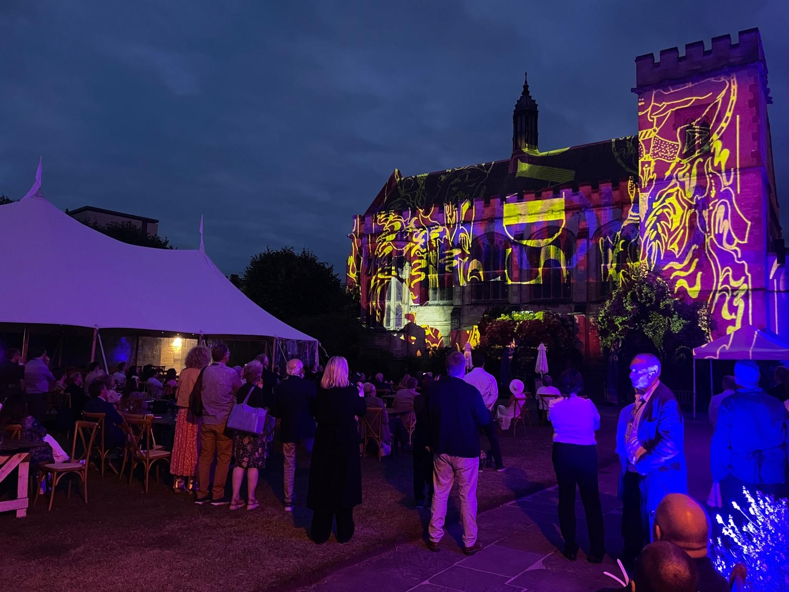Guests watch the Light Show displayed on the side of the Hall.
