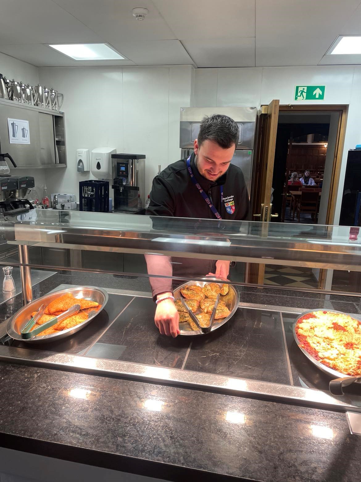 Jamie Tricker, Deputy Butler, pictured serving food in the Forte Room.