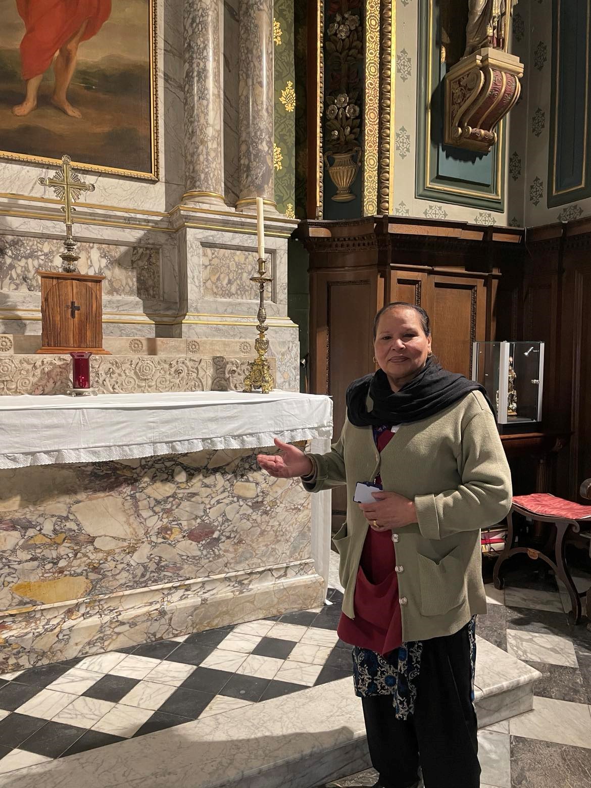 Krishna Singh, Pembroke's longest-serving Scout, pictured in the Chapel by the altar.