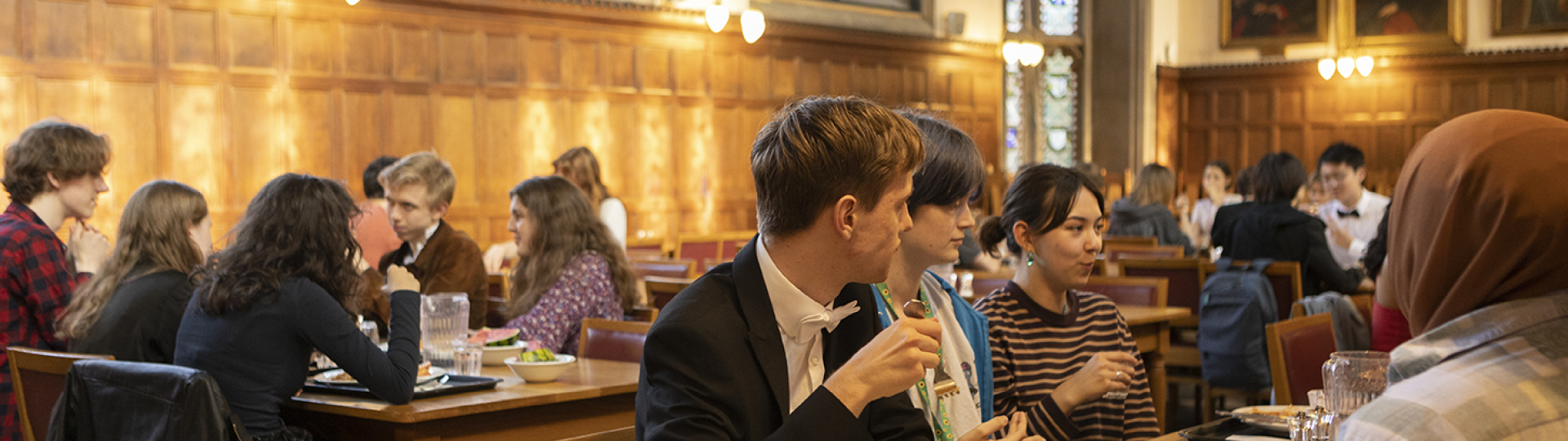 Students eating together in Hall. Credit Gavin Kingcome