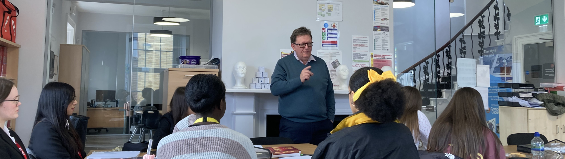 Dr Peter Claus talking to students in classroom