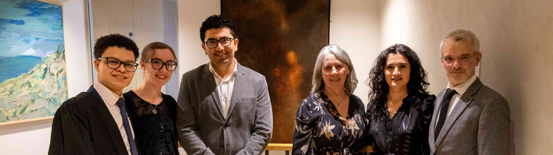 Group stood in front of new painting